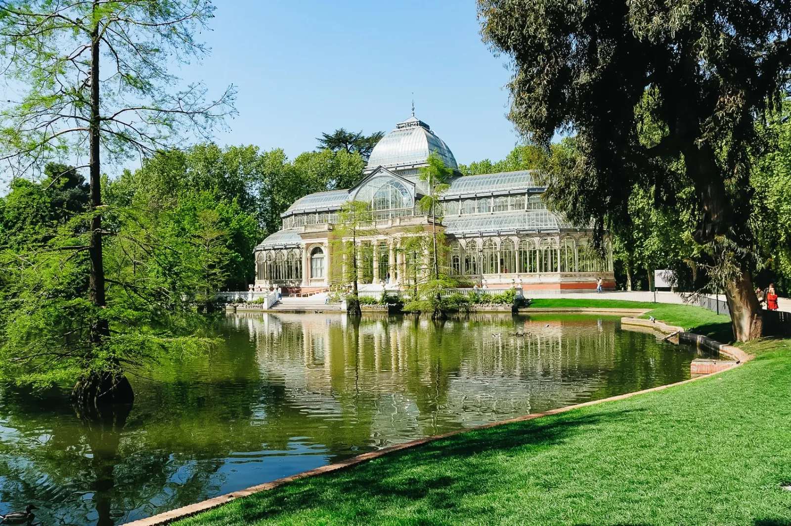 The Palacio de Cristal reflected in its pond, Retiro Park, Madrid