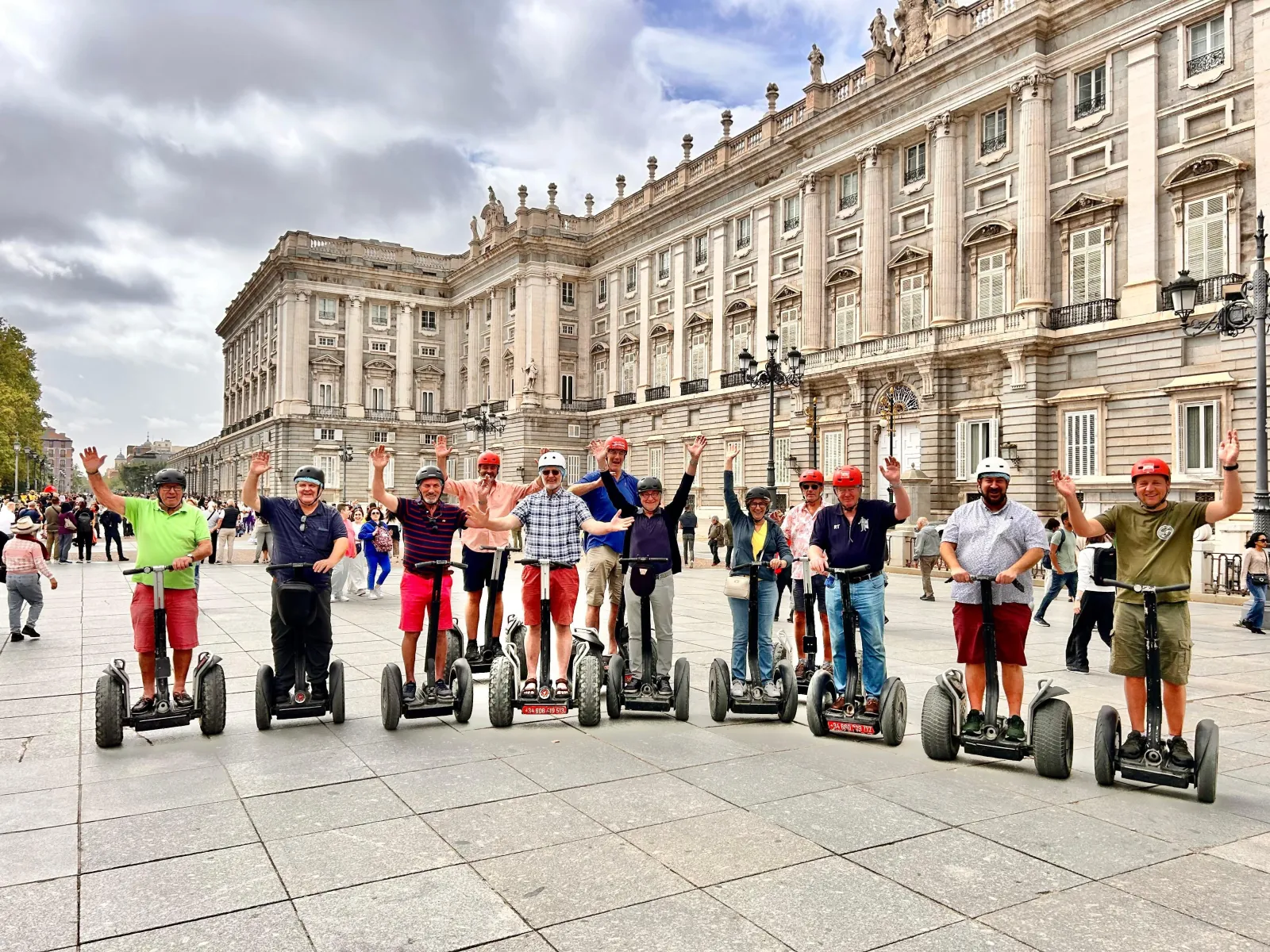 Riders on Segways along the Royal Palace colonnade