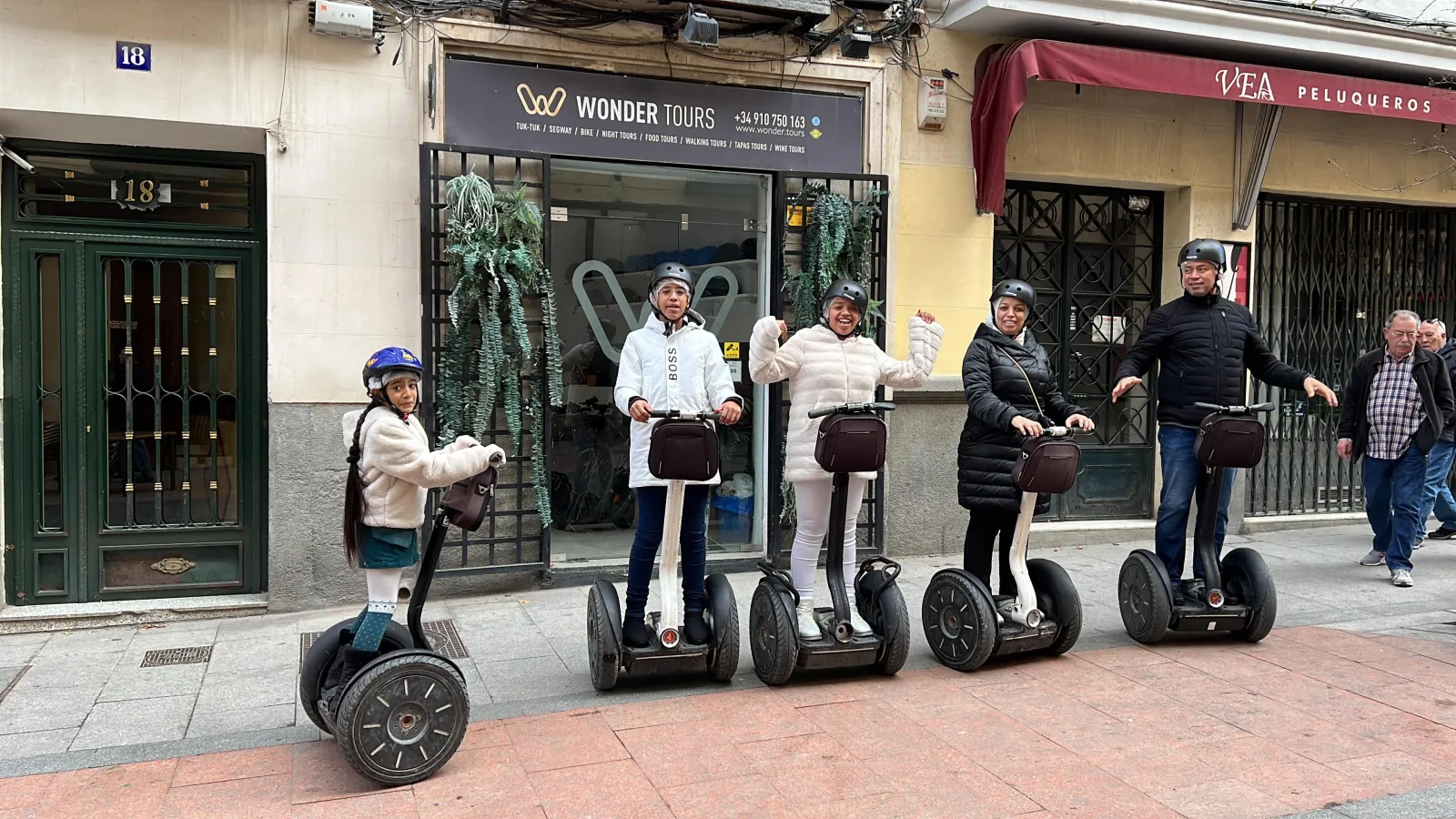 Riders with their Segways outside the tour shop in central Madrid