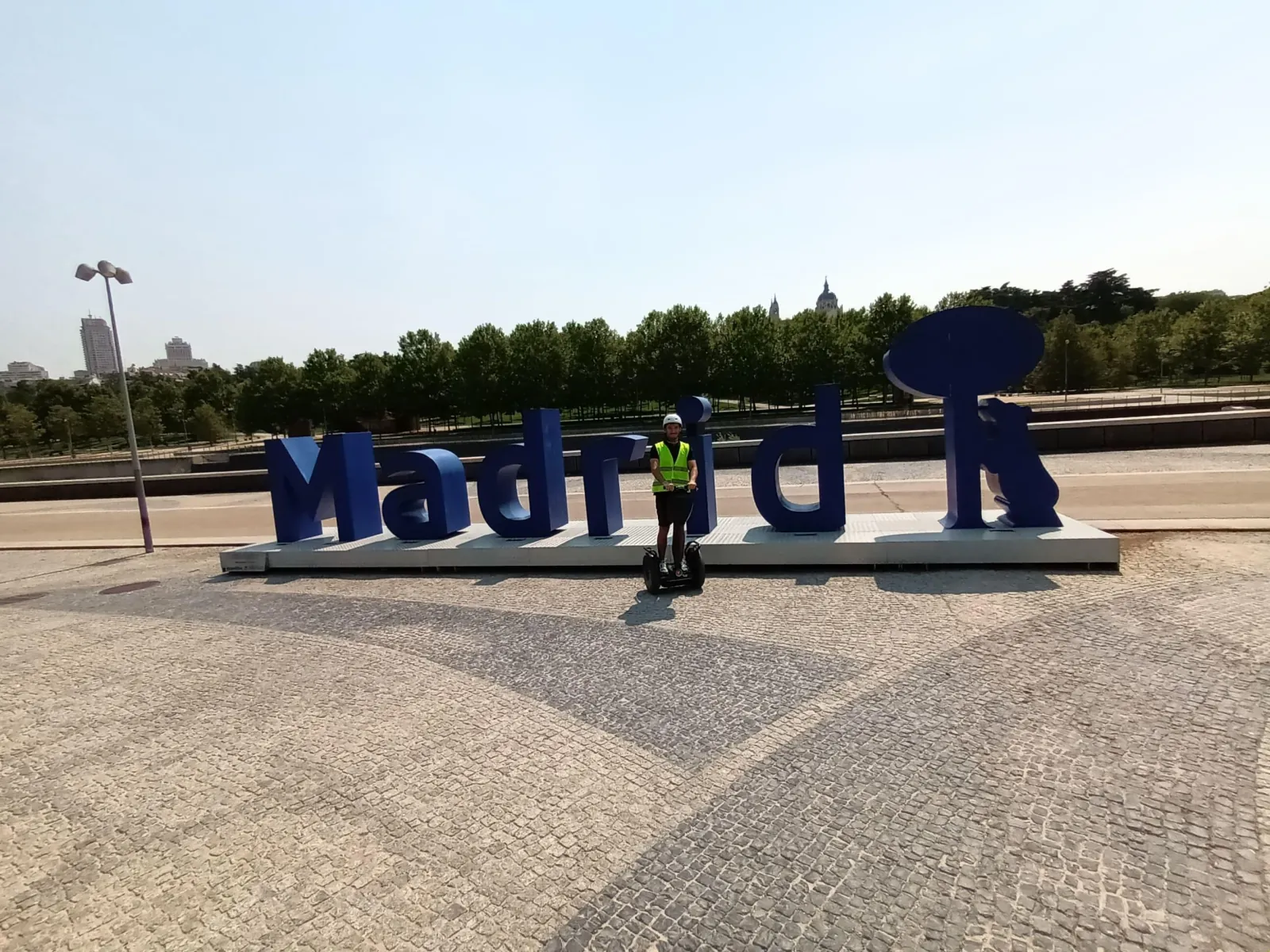Segway riders at the Madrid Río sign beside the Manzanares