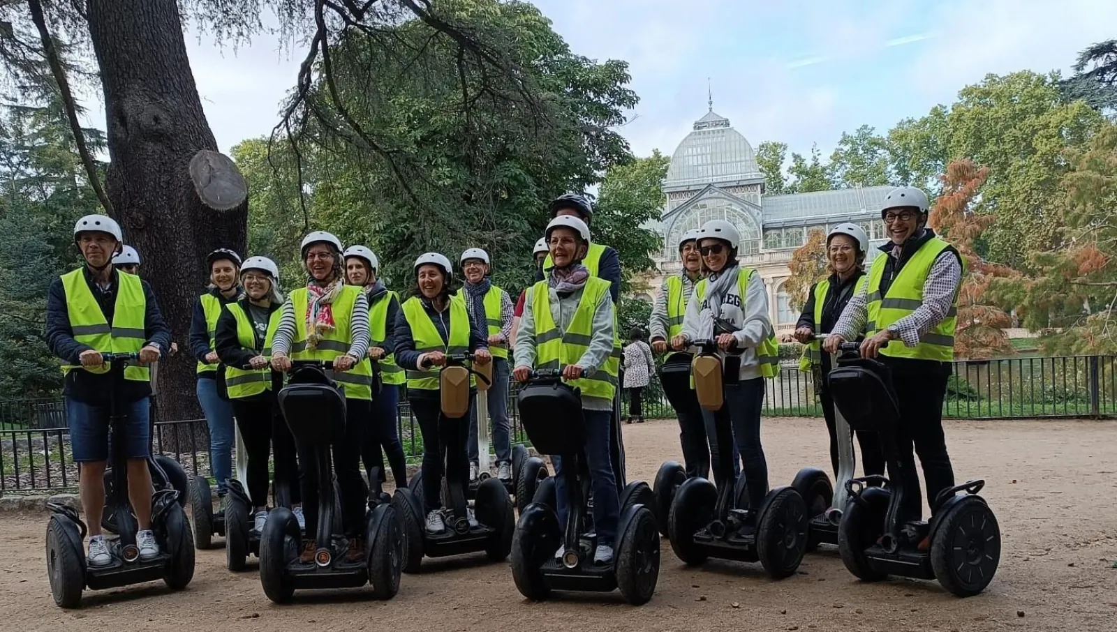 Segway group among the trees on a Madrid park path