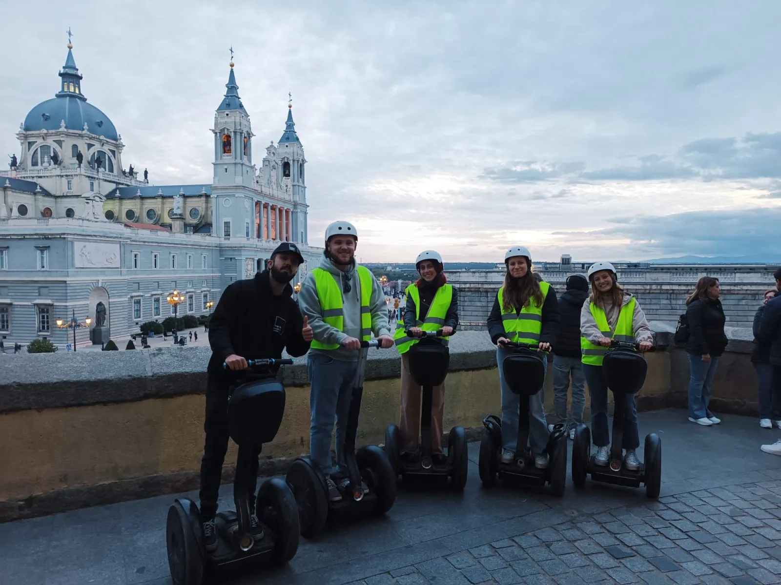 Segway group with the Almudena Cathedral behind them