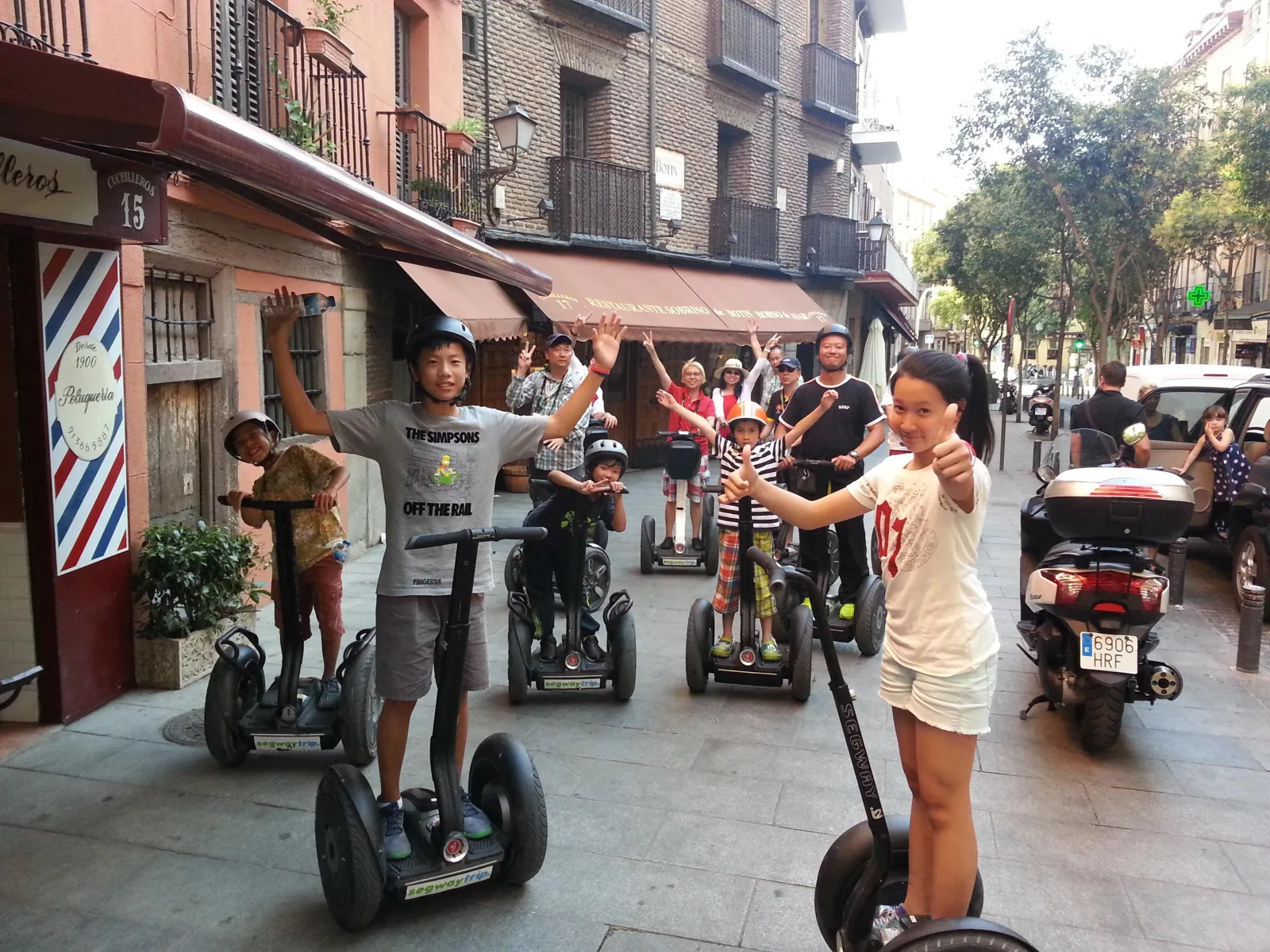 Rider on a Segway in a narrow street in old Madrid