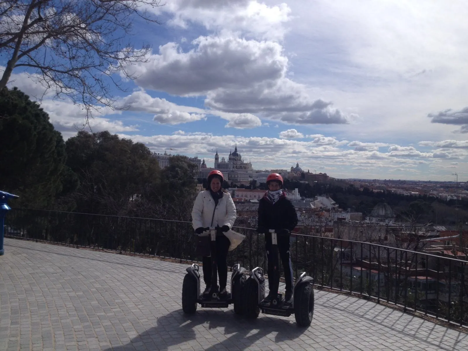 Segway riders on a terrace above the Madrid skyline