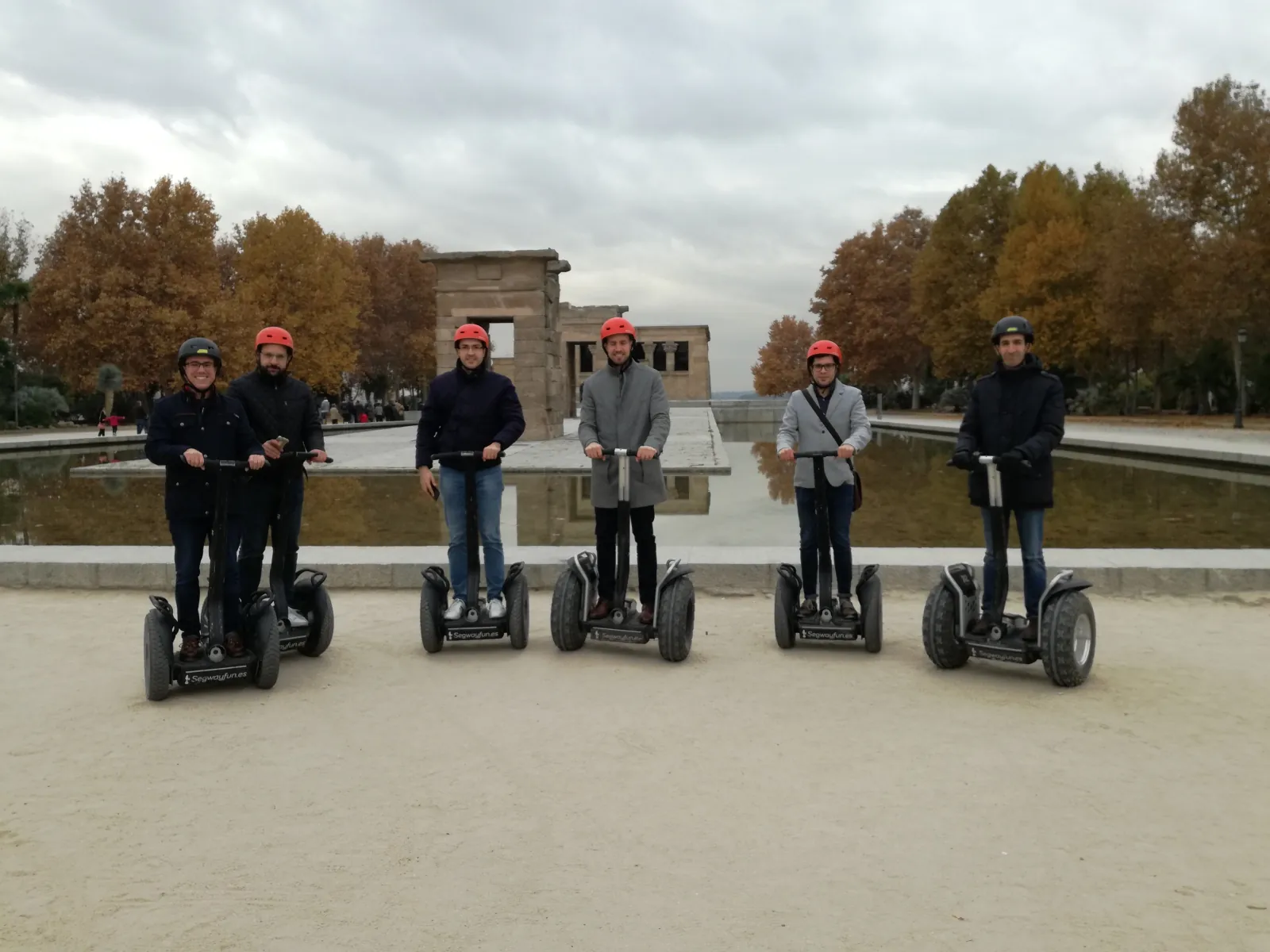 Segway riders along the Retiro lake in autumn