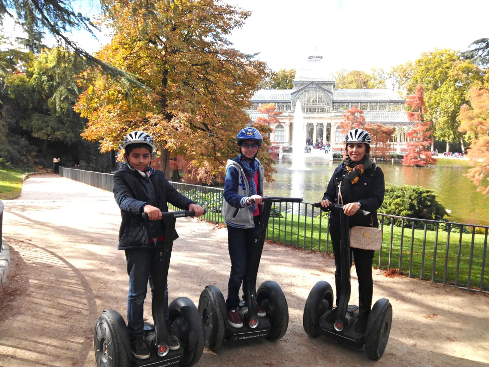 Segway group in front of the Palacio de Cristal in autumn