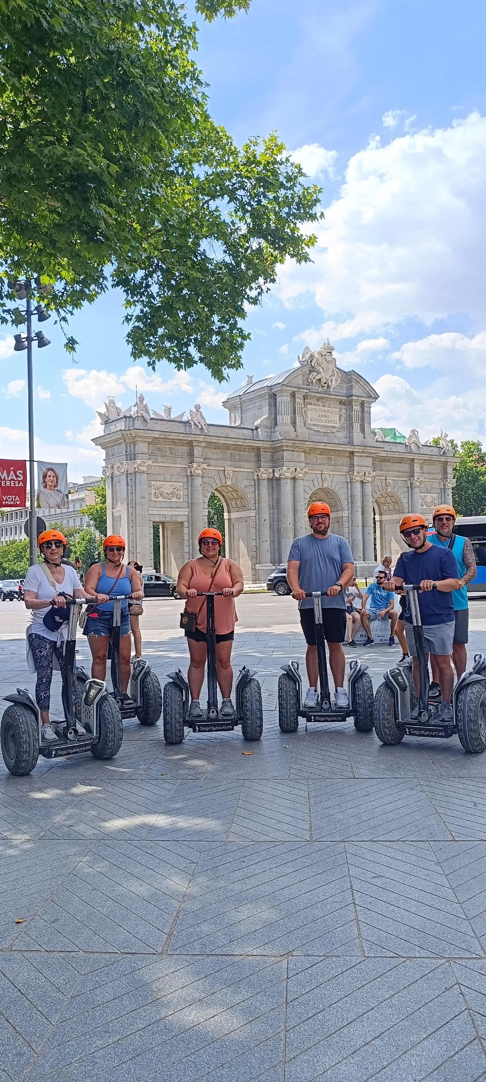 Riders on Segways at the Puerta de Alcalá in Madrid